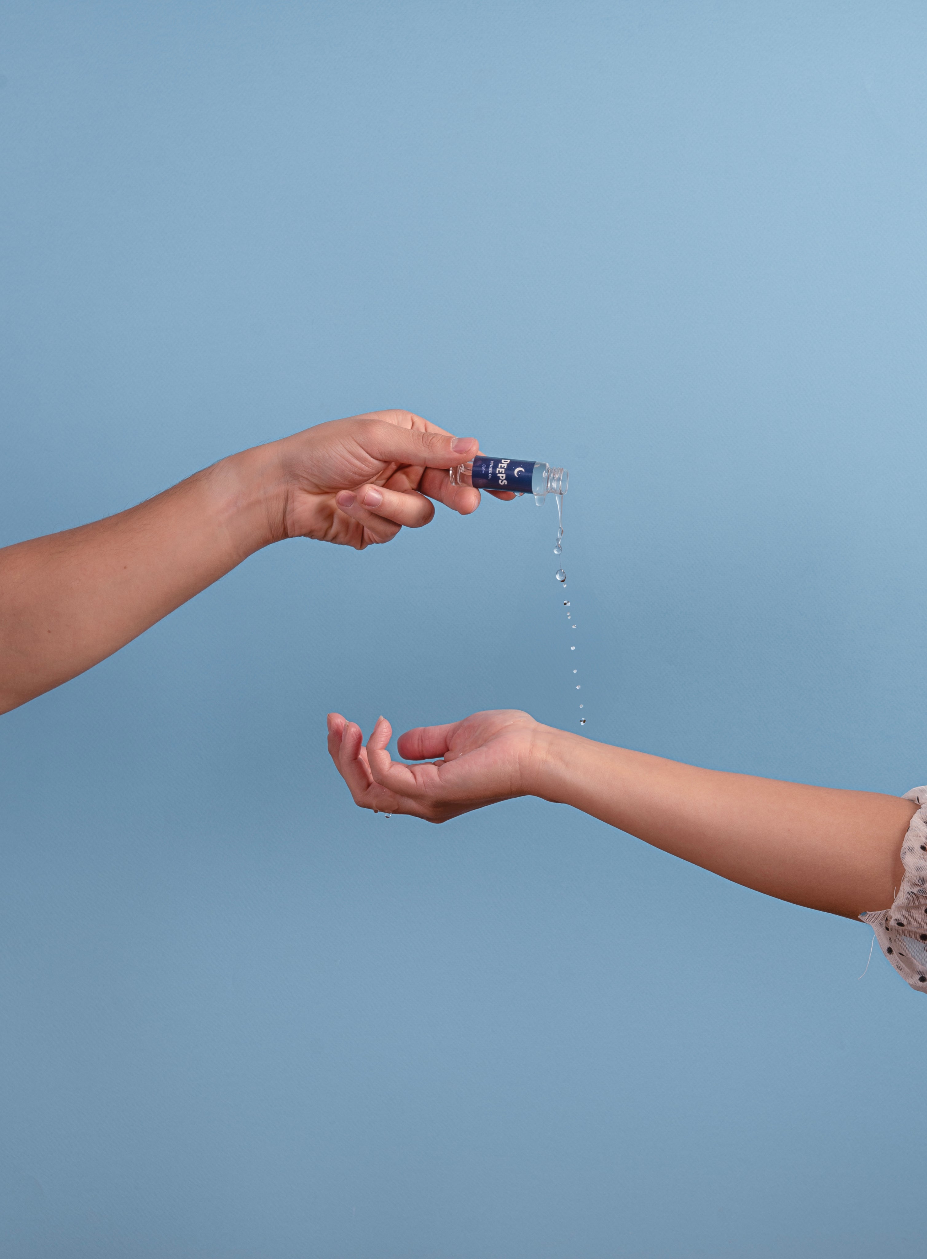 DEEPS Essential Oil poured on wrist
